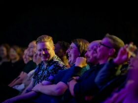 Audience members laughing during a previous show at Brisbane Comedy Festival.