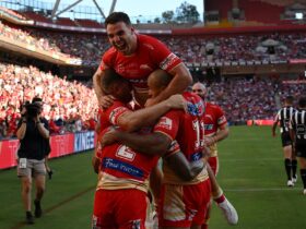 An image of Dolphins players celebrating at Suncorp Stadium