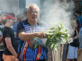indigenous man conducting smoke ceremony