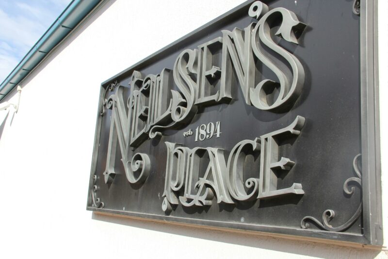 Neilsen's Place Metal Sign