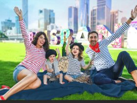 Family on picnic rug in front of Brisbane City