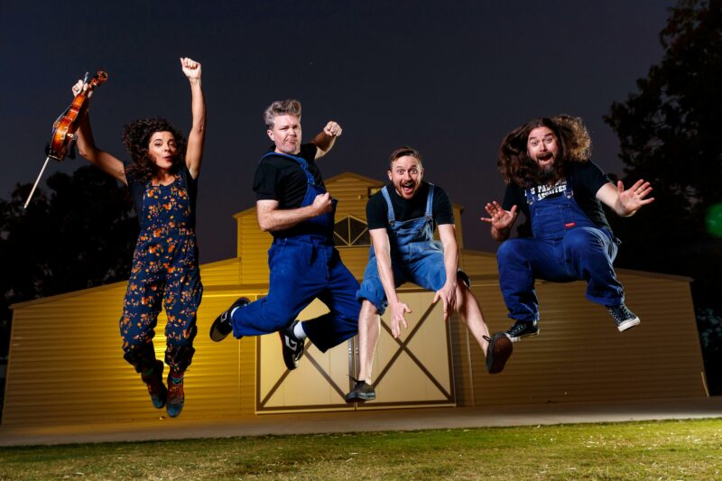 Four happy people jumping into the air