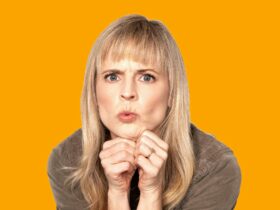 Maria Bamford - Maria photographed from the shoulders up with her head resting on her fists