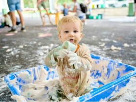 baby plays in slime messy play