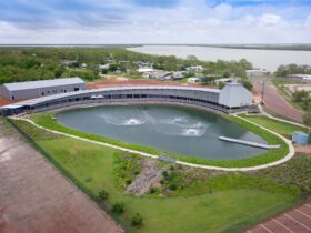 Large building which is the Barramundi Discover Centre and the large pond