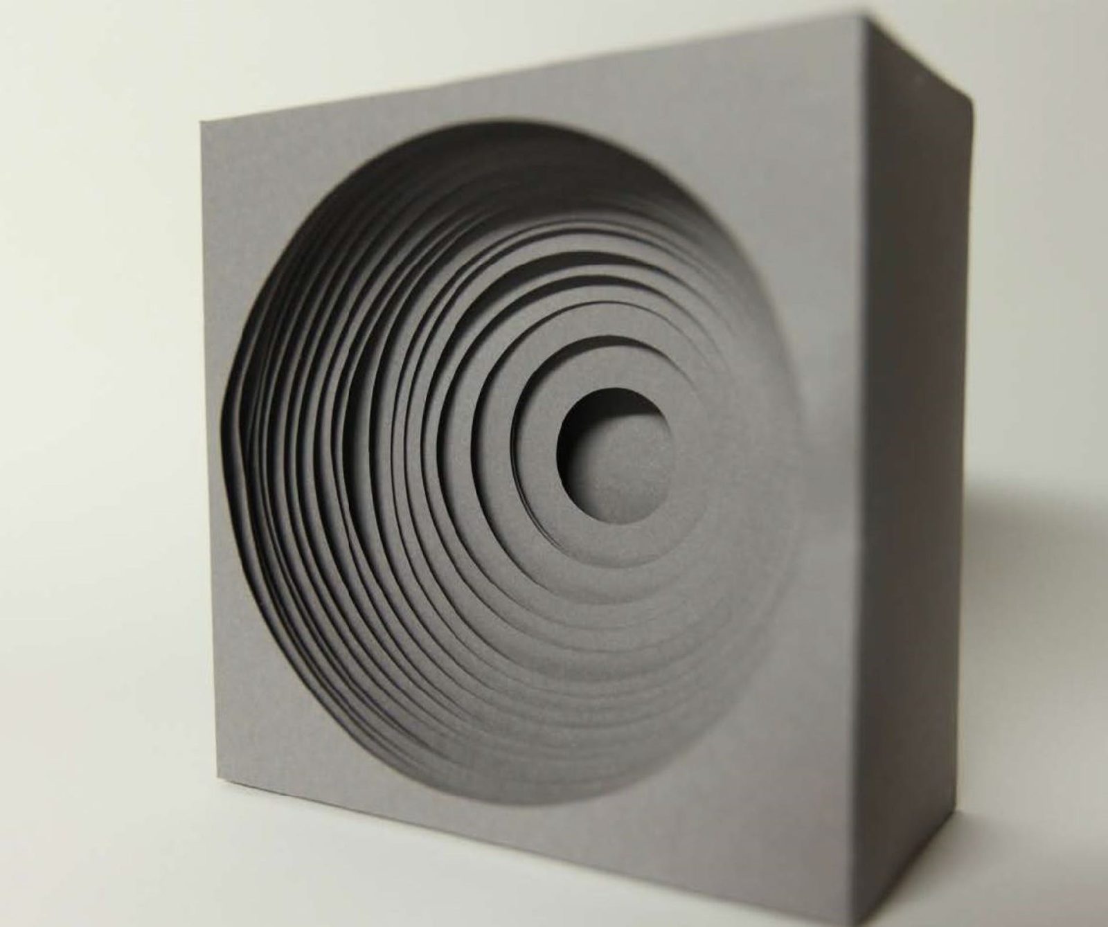 Photograph of grey paper sculpture