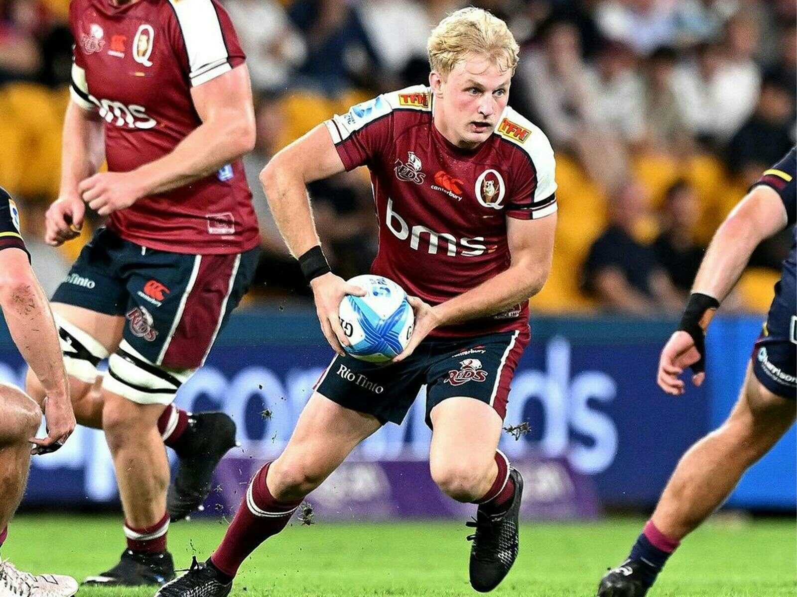 Tom Lynagh playing rugby union with the ball in hand for the Queensland Reds at Suncorp Stadium