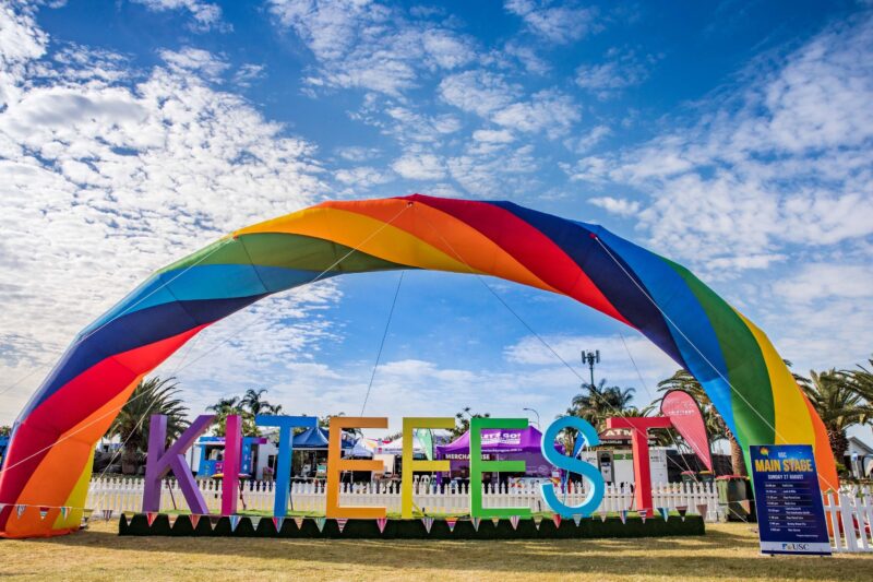 Rainbow coloured large KiteFest sign