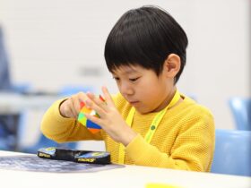 Child solving a skewb