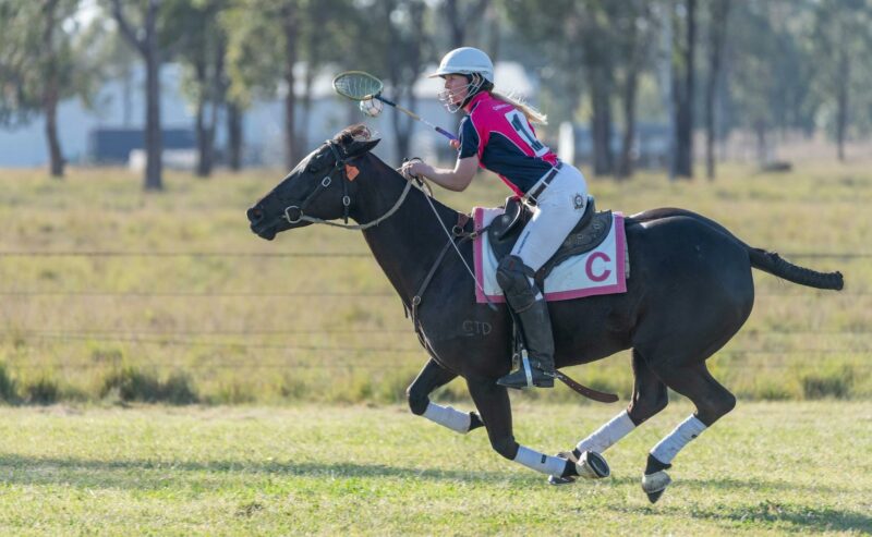 Lindsey Doolan of Chinchilla Polocrosse Club carting the ball down the field