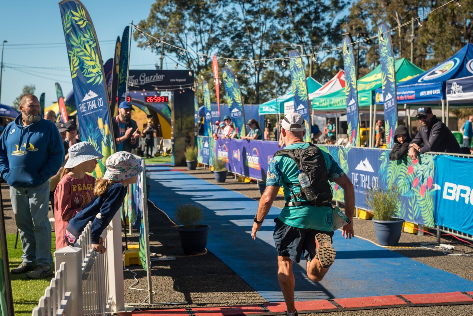 The Guzzler Ultra Finish chute lined with flags, spectators and tents