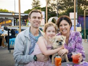 Family with a dog enjoying the Twilight Market