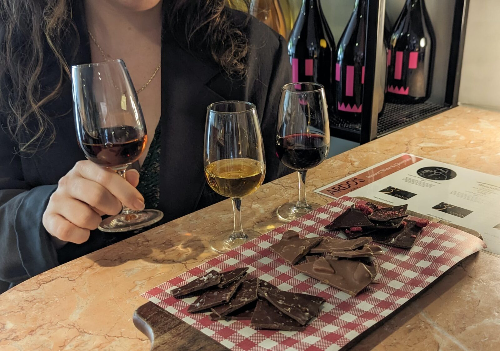 3 Wine and 3 Varities of chocolate on a board with educational display