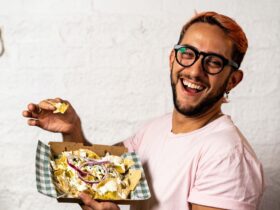 Male laughing with Mexican food