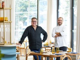 Celebrity chef & head chef both standing together in Settimo