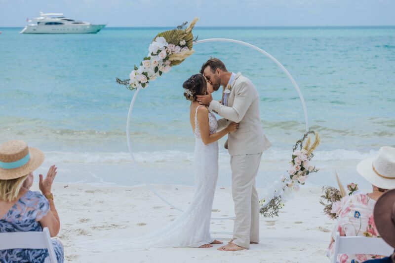 Couple Kissing Wedding Whitehaven Beach Round Wedding Arbour