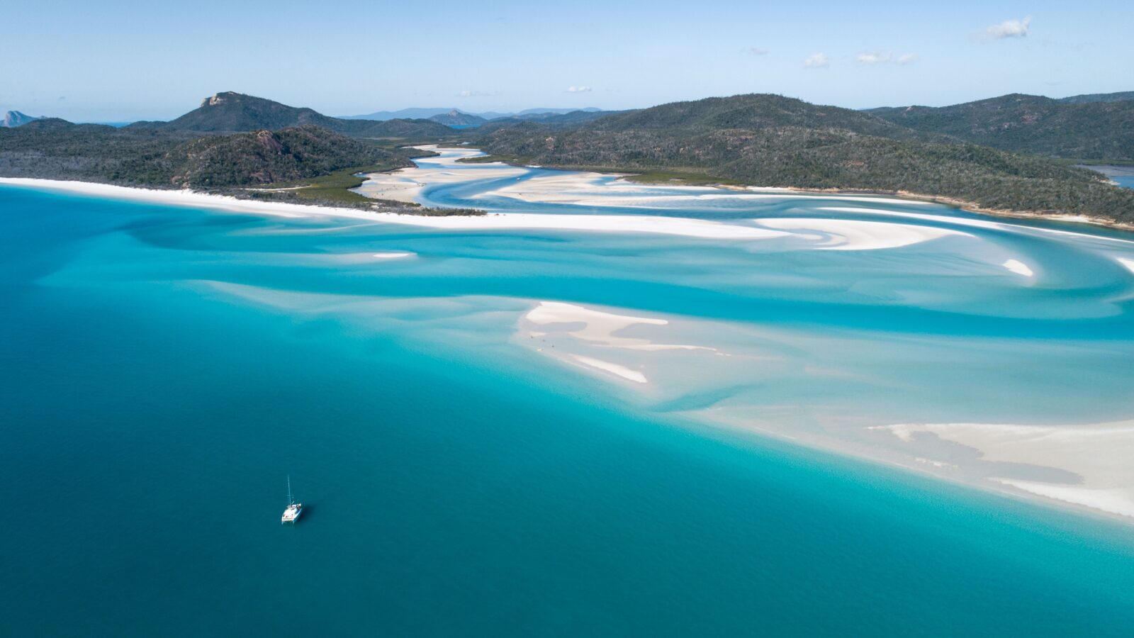 Spectacular white sandy beaches all yours to explore sailing the Whitsundays on a Bareboat Charter