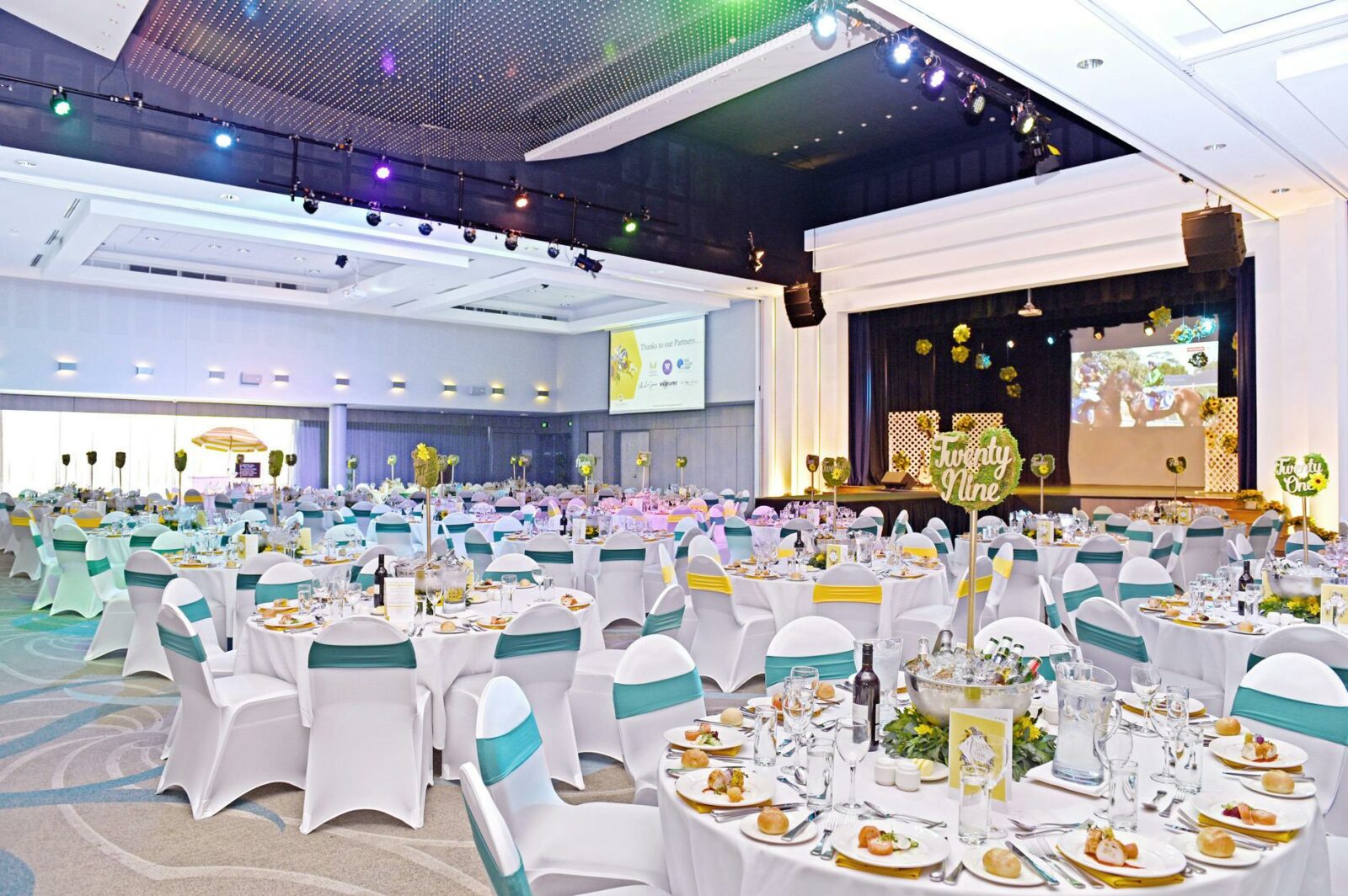 A gala lunch decorated with blue, white and gold theming