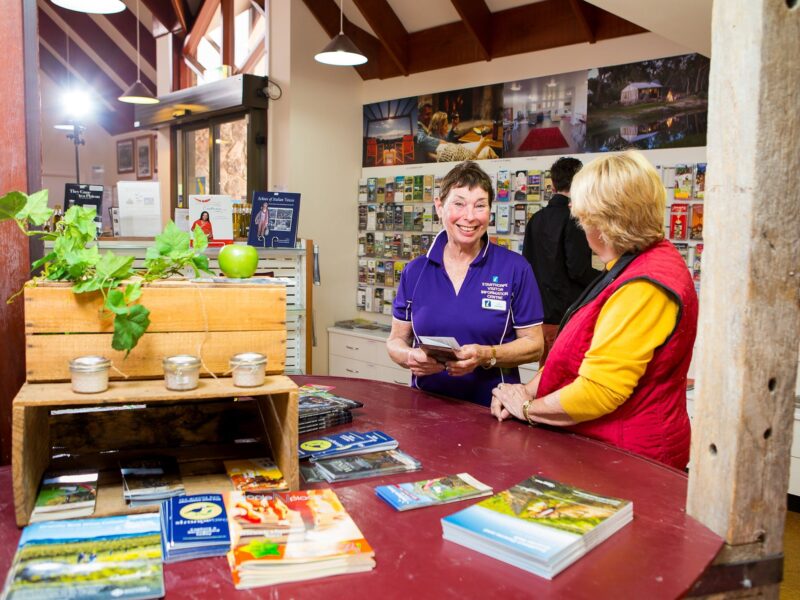 lady helping a visitor at the Stanthorpe Info Centre
