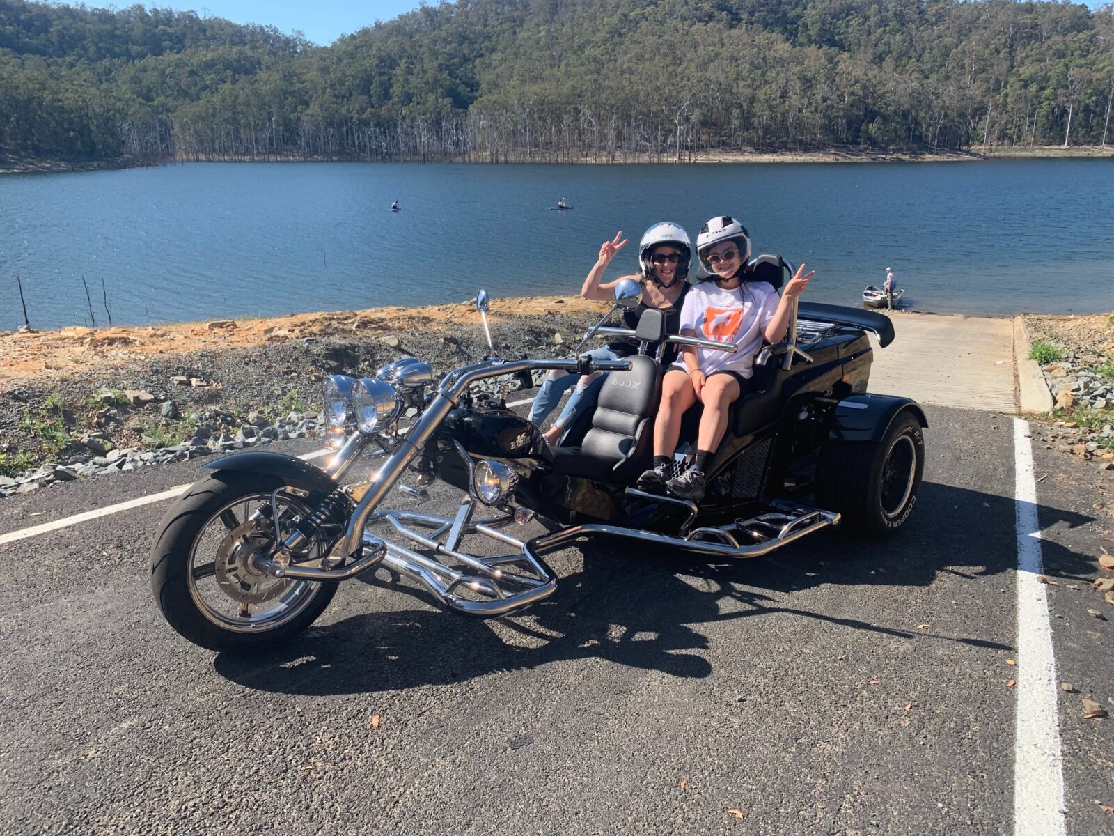 Image shows a boom mustang trike parked near the waterfront of Hinze Dam.