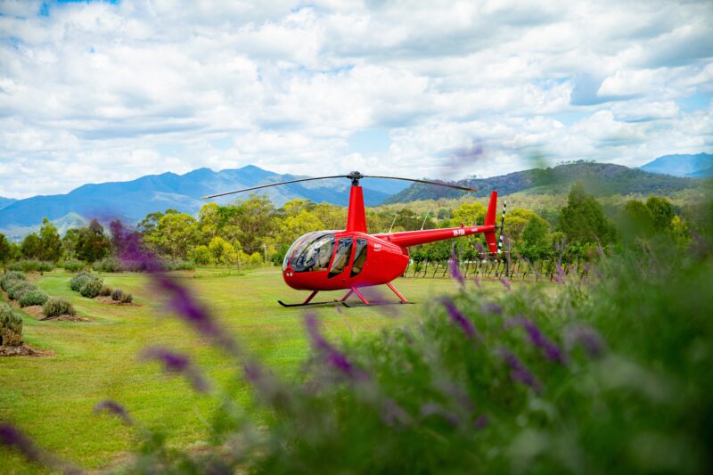 Our flagship Robinson 44 helicopter with full view glass doors at Kooroomba Lavender Farm.