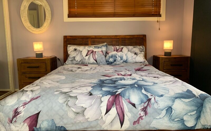 Queen size bed in bedroom 2.