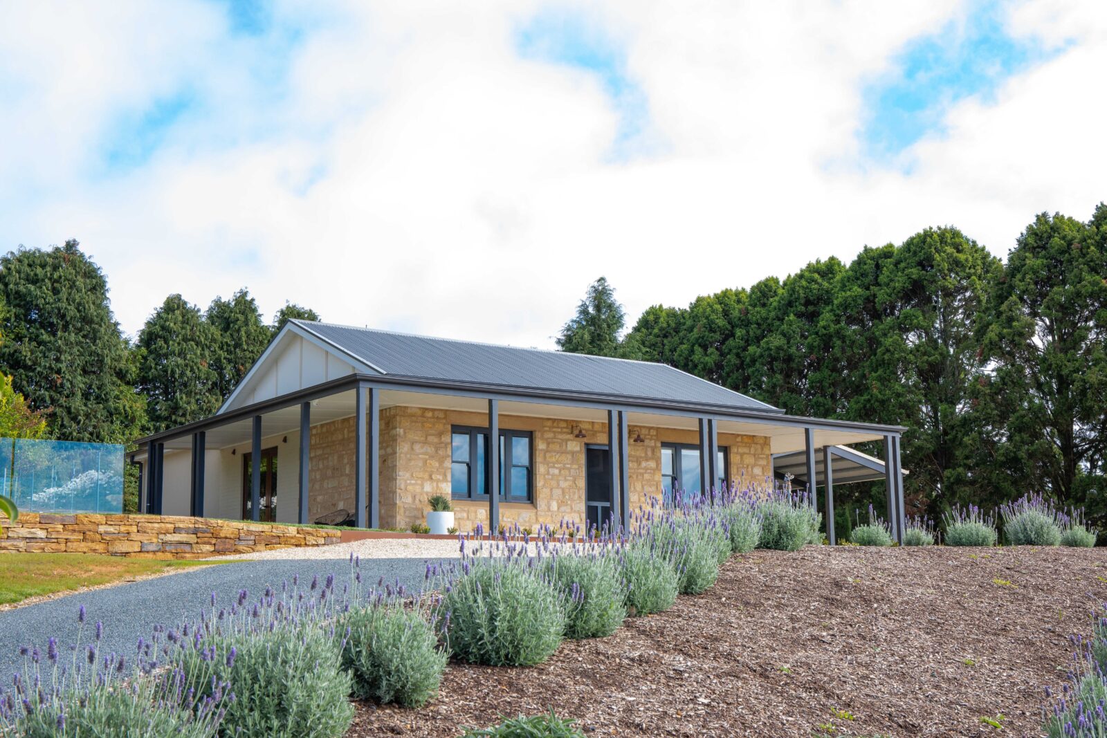 Adelaide Hills House is a stone cottage with views across the Piccadilly Valley in South Australia.