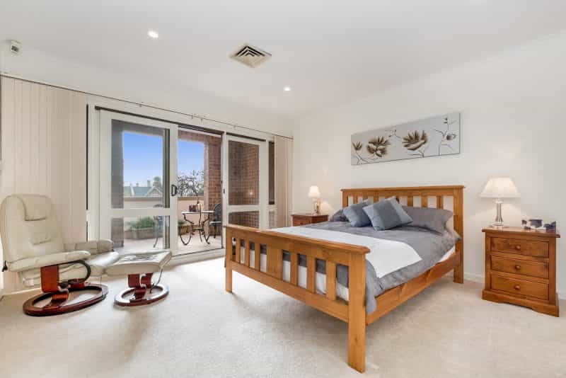 Spacious main bedroom with walk in wardrobe, balcony and luxurious onsuite bathroom