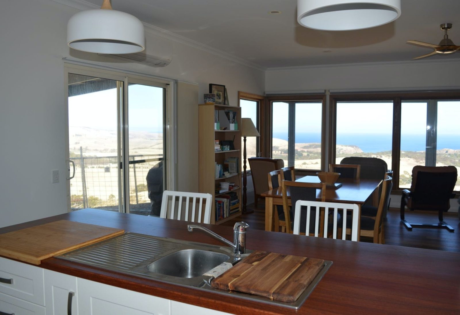 Kitchen, dining room, entrance and view to the sea