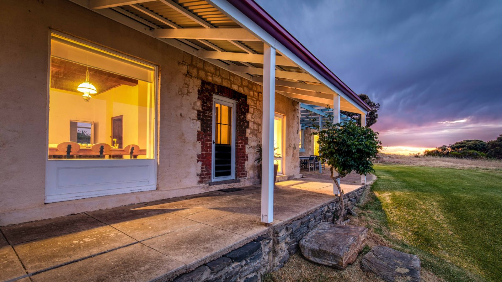 Northern side verandah, stone and glass of historic Nat's Retreat Kangaroo Island