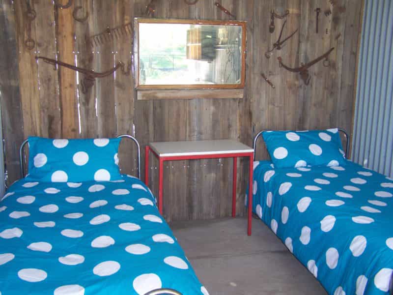 Interior of hut 2 of 4 beds and rustic wooden wall