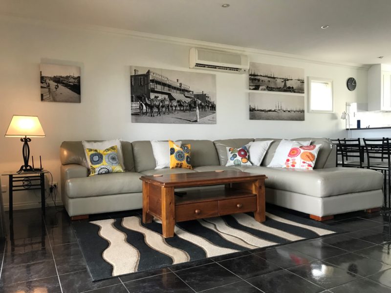 view of the lounge room featuring historic photos of Pt Augusta