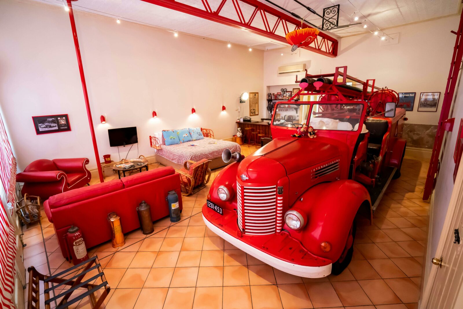 Indulge in the world-famous unique Fire Engine Suite, with its 1942 International Fire-truck
