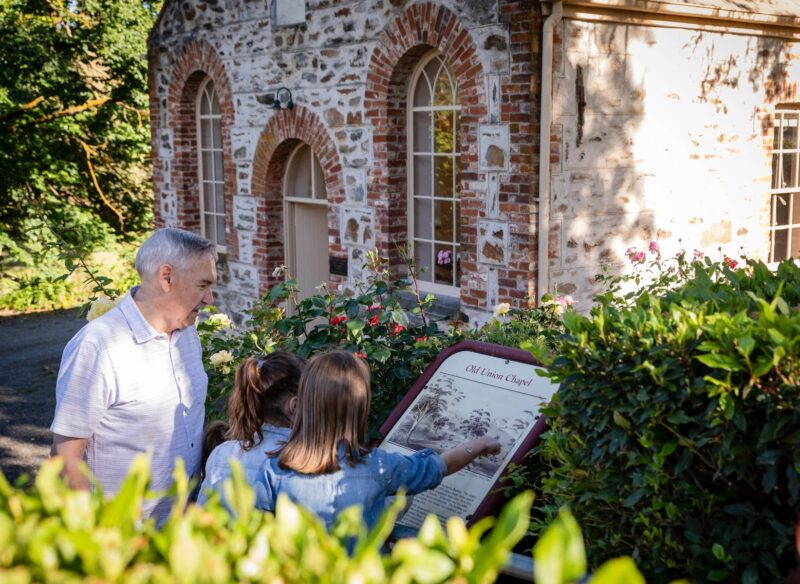 Adult and children visiting the Old Union Chapel in Angaston