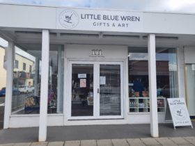 Front of our shop, white double doors, window frontage with sign that reads Little Blue Wren Gifts