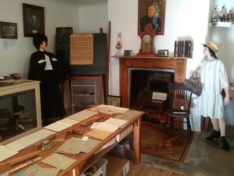 Schoolroom holds many german exercise books, Bibles, Baptism and confirmation certificates