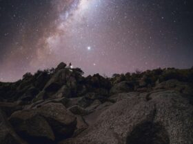 The stars of the Milky Way shine brightly above a rocky cliff at Mannum.
