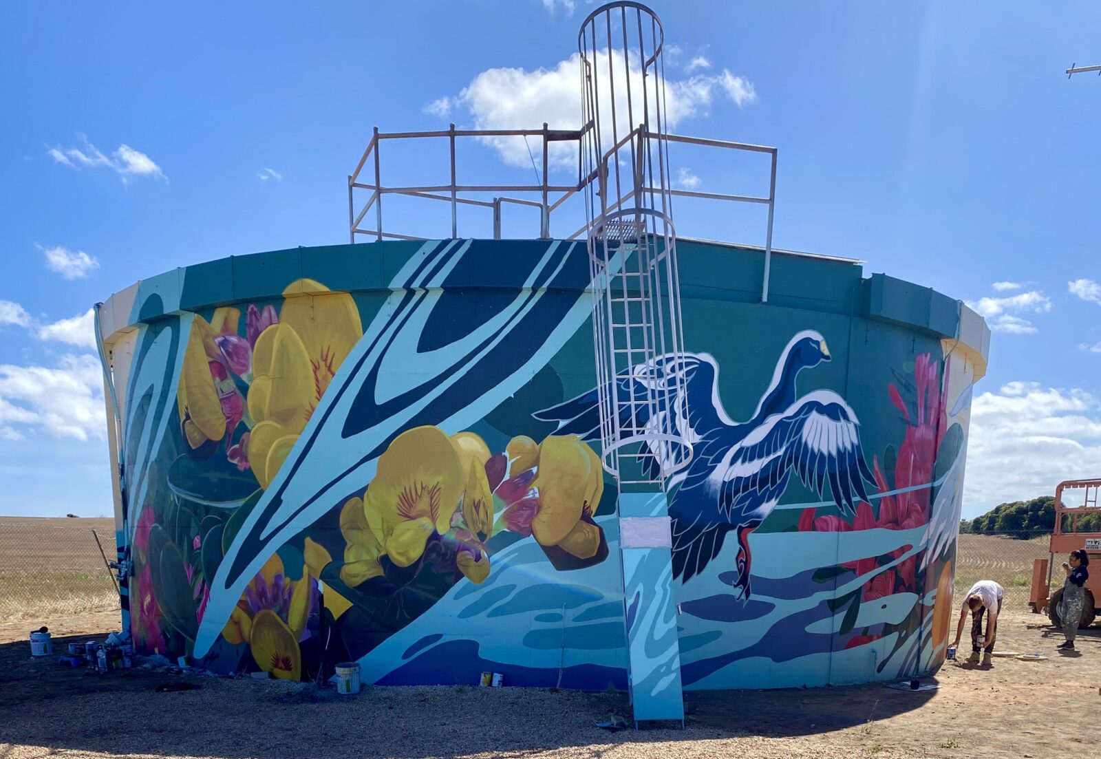 Water Tank covered in mural of local birdlife. Access ladder visible.