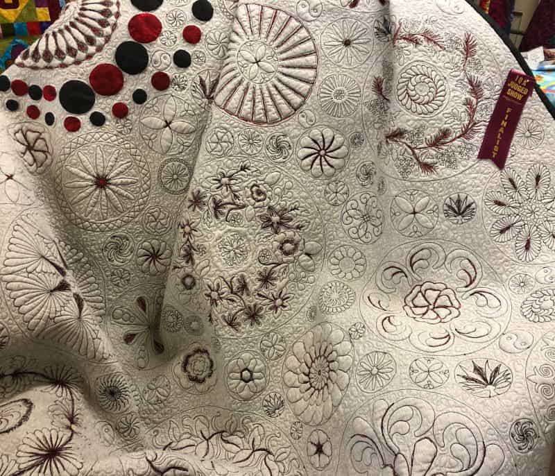An original quilt consisting of hand appliqué and machine quilting
