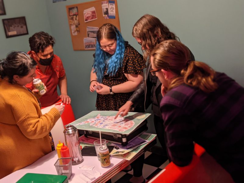 Players work together to solve puzzles