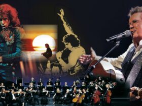 An orchestra in front of a picture collage