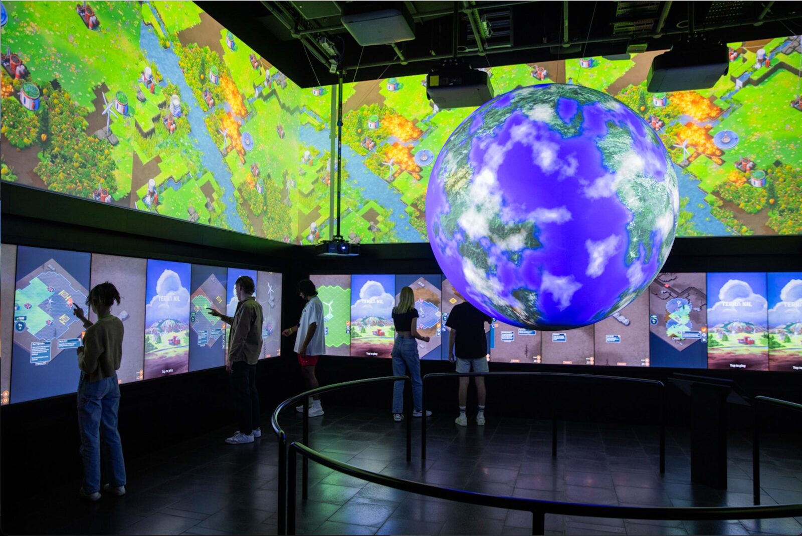 a large sphere with touch screens surrounding