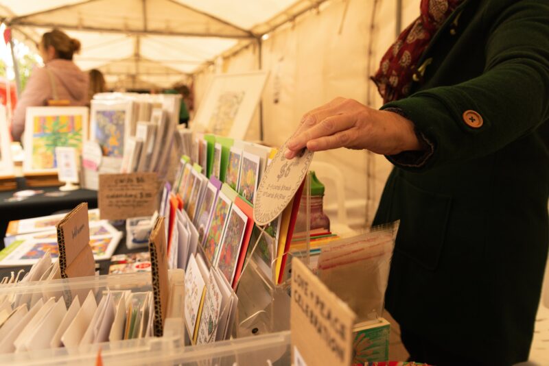 Close up photo of some cards on sale in a market stall