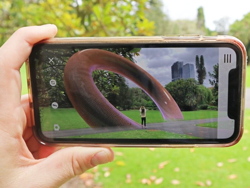 A large hoop is shown on a mobile phone screen in the Botanic Garden