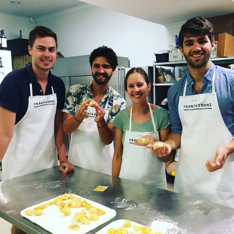 cooking school guests with their hand made ravioli!