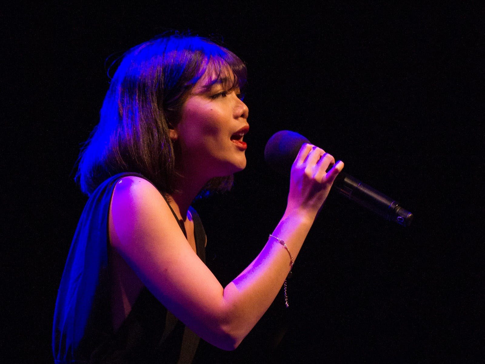 Performer Kathy Bui singing