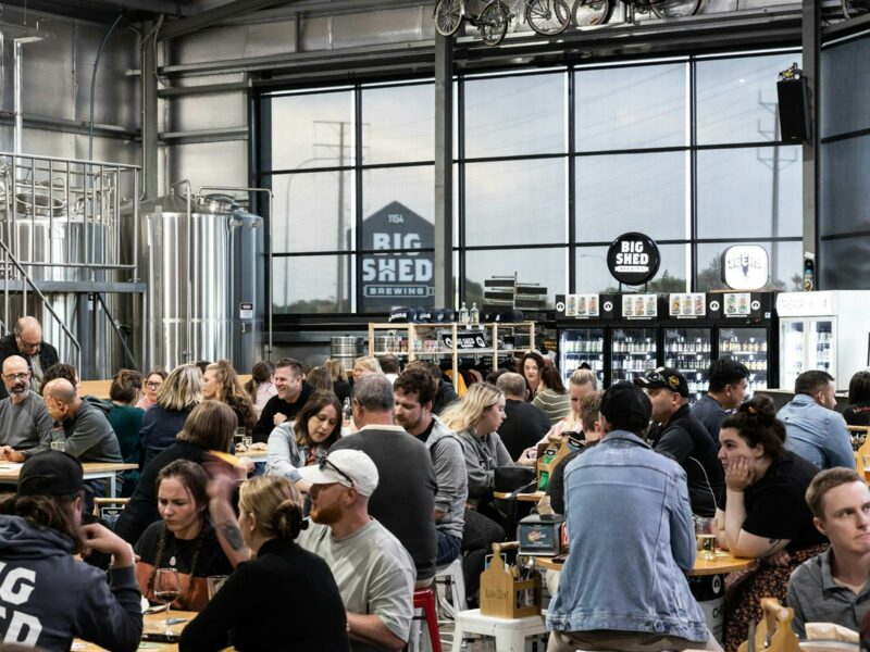 Customers sitting at tables in Big Shed taproom