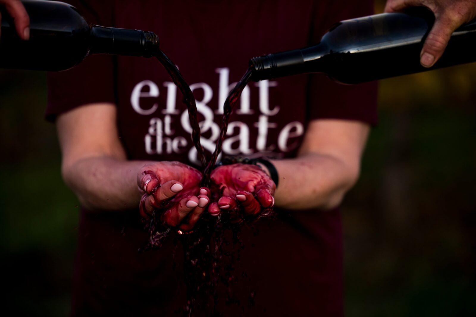 wine pouring over hands
