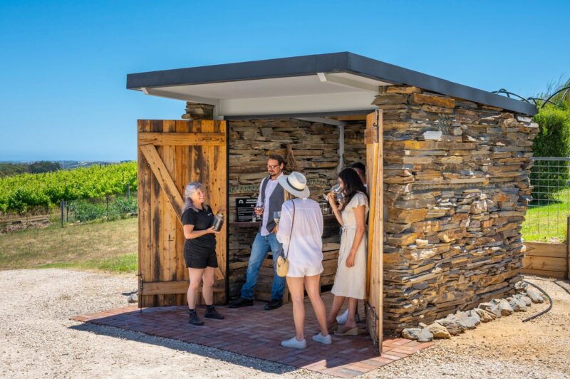 guests enjoy a wine at the Biodynamic Hut