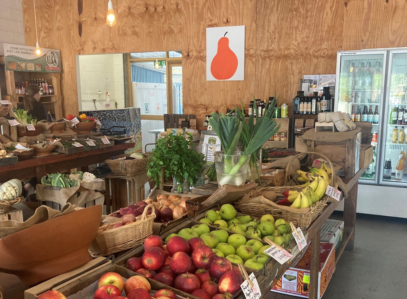 fruit and vegetables in stalls inside a shop